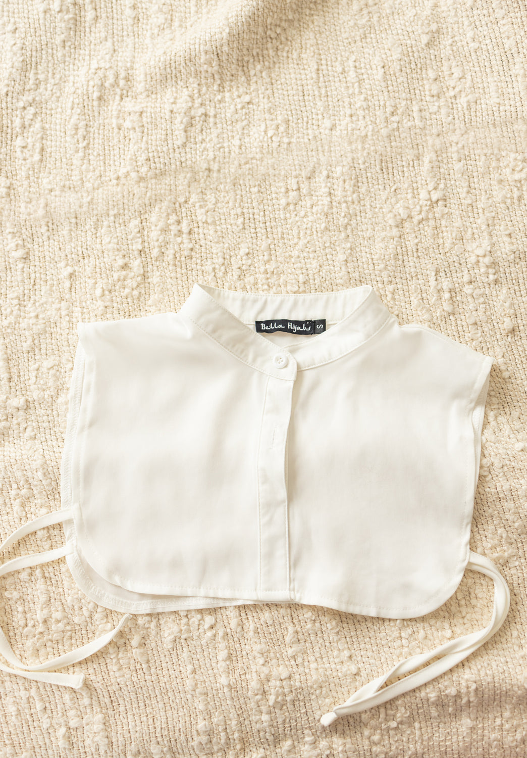 white fake collar with buttons