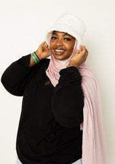 woman wearing modal hijab in different sizes in a light pink shade