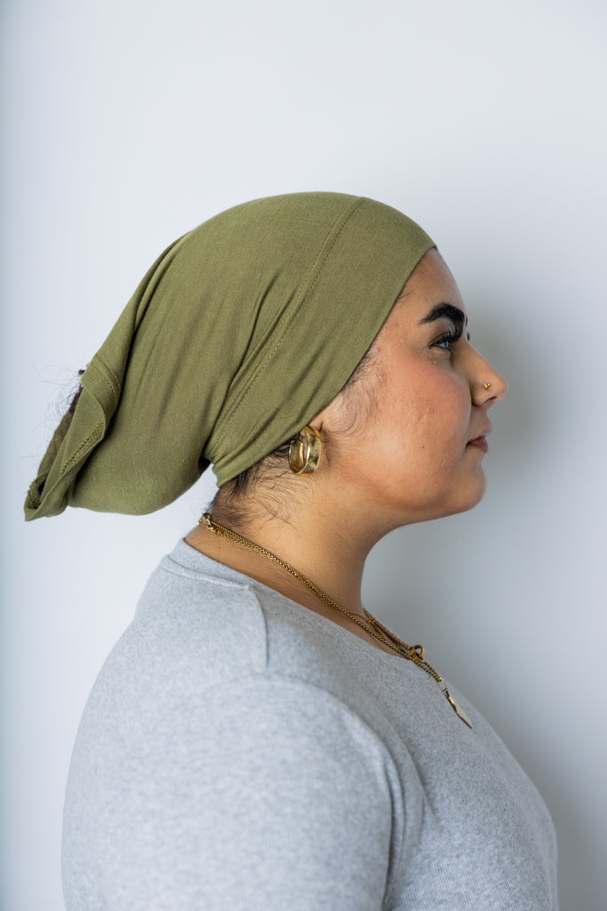woman wearing an olive green under scarf tube cap for hijab