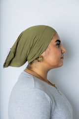 woman wearing an olive green under scarf tube cap for hijab