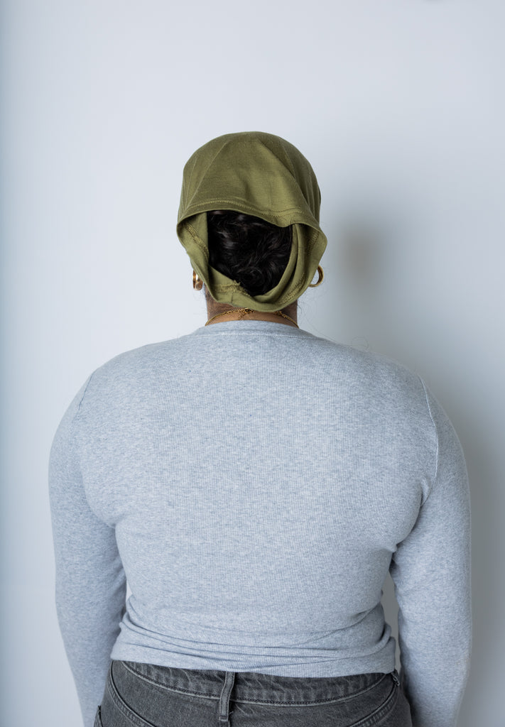 woman wearing an olive green under scarf tube cap for hijab
