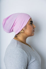 woman wearing a light pink under scarf tube cap for hijab
