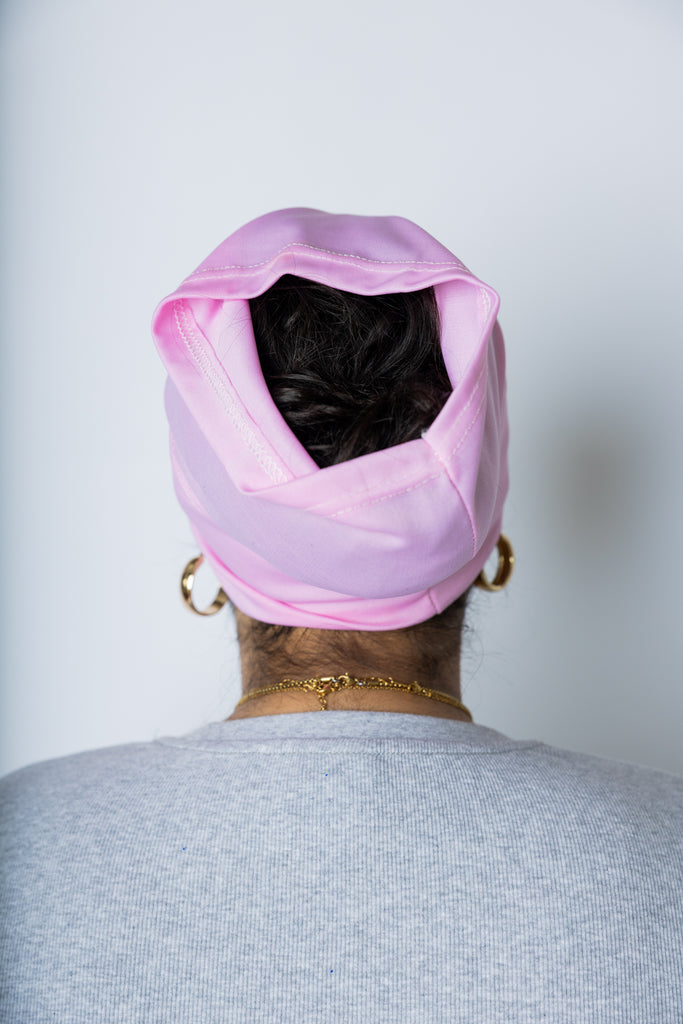 woman wearing a light pink under scarf tube cap for hijab