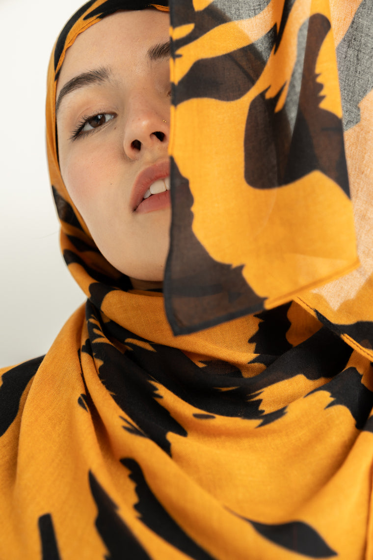 Tiger Stripes modal hijab, a striking blend of deep gold and bold black