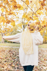 solid light yellow hijab made with modal fabric and embellished with lace at the ends