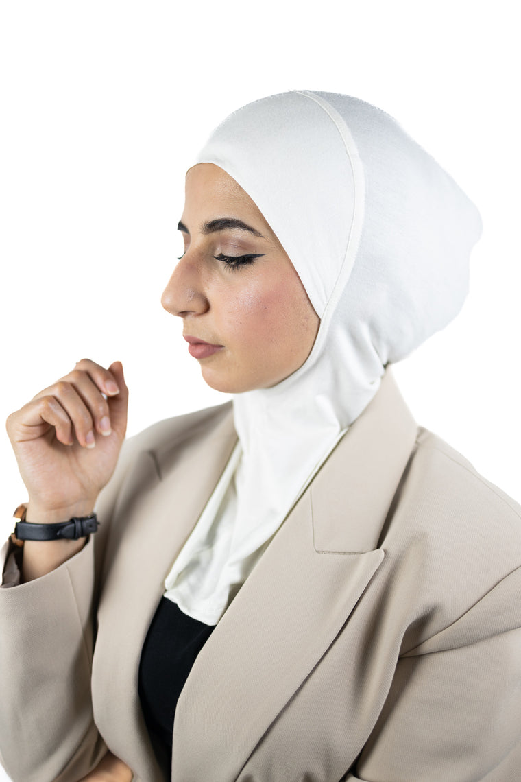 muslim woman wearing a beige blazer and off white ninja underscarf