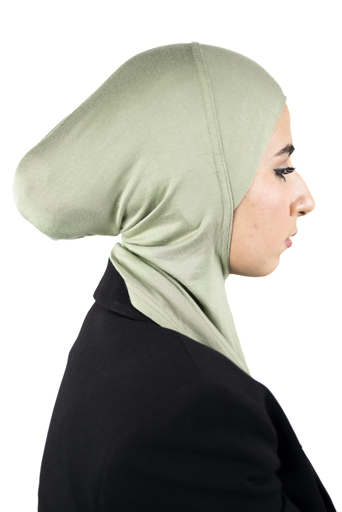 muslim woman wearing a beige blazer and lime cream ninja underscarf