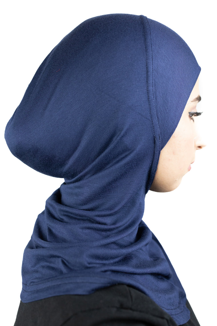 muslim woman wearing a beige blazer and navy blue ninja underscarf