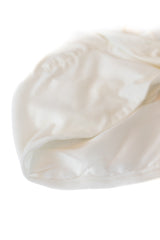 jersey off white satin lined under cap with adjustable tie and silicone non slip grip