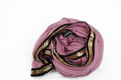 blush jersey hijab embellished with a gold trim along the edges