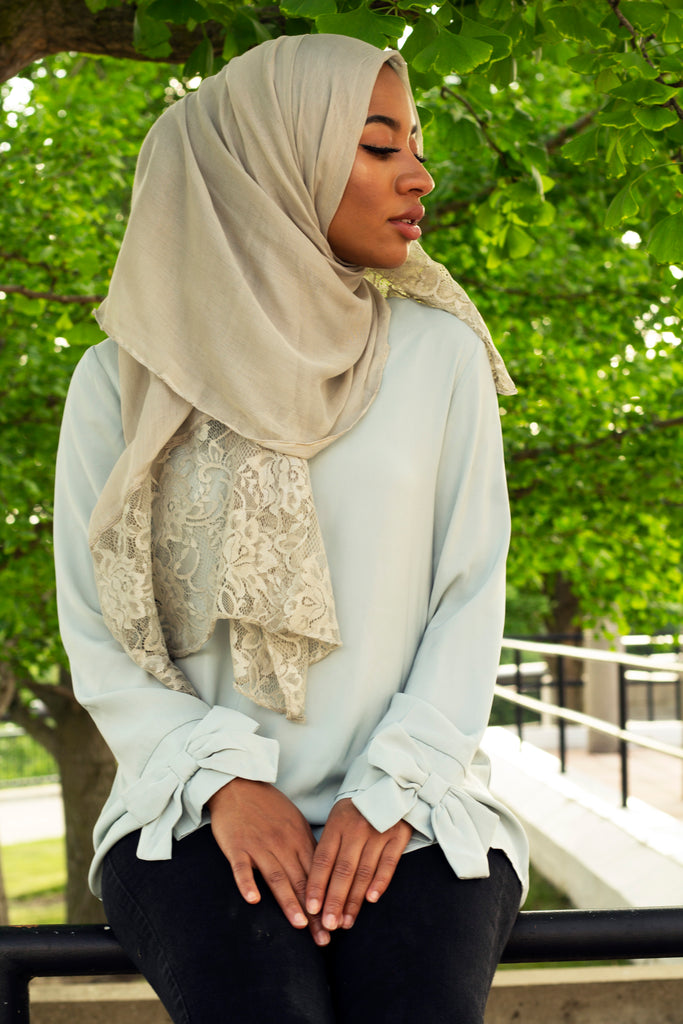 solid gray hijab made with modal fabric and embellished with lace at the ends