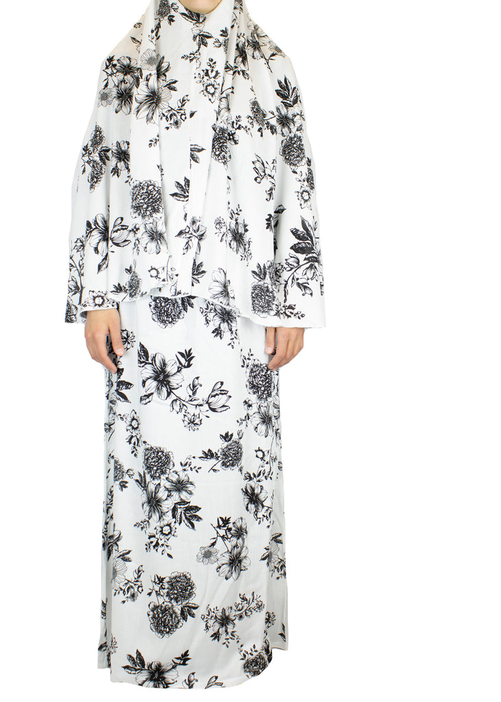 two piece salah outfit with hijab and skirt printed with black and white floral