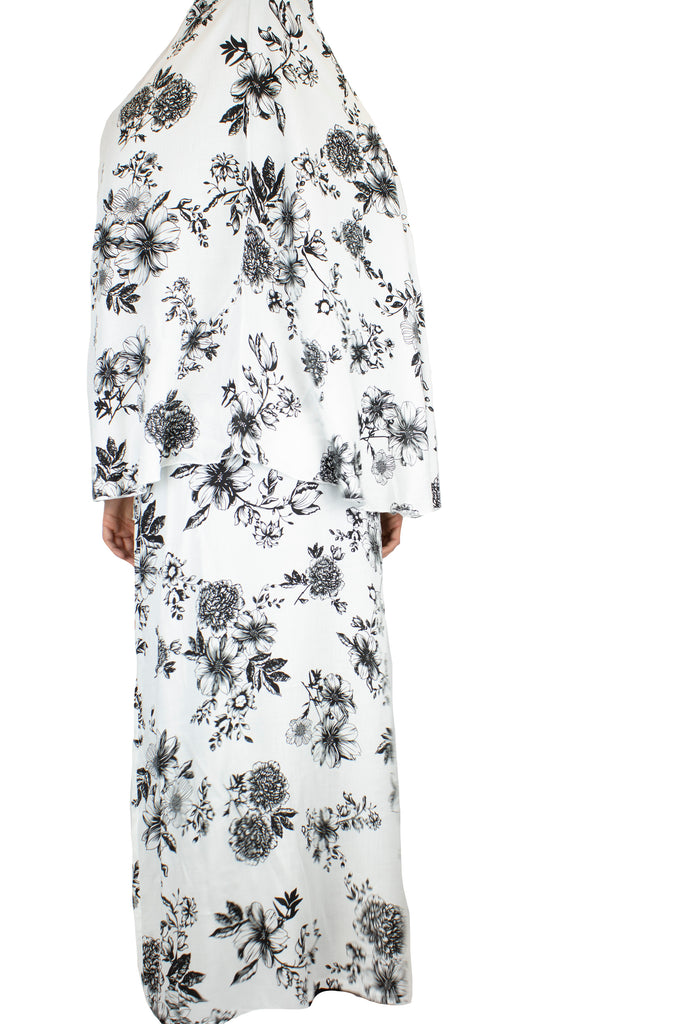two piece salah outfit with hijab and skirt printed with black and white floral