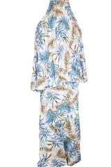 two piece salah outfit with hijab and skirt printed with blue, white, and beige leaves