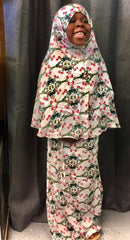 young muslim child wearing prayer set with hijab and skirt