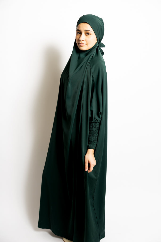 one-piece prayer outfit features a quick attached tie-back hijab