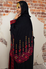 woman wearing black modal print hijab with tatreez Palestinian design 