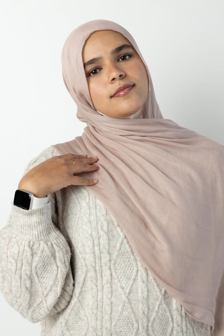 three women in a group photo wearing modal hijab in different sizes in a truffle mushroom light sand stone tan shade 