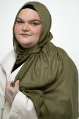 woman modeling a moss green modal hijab 