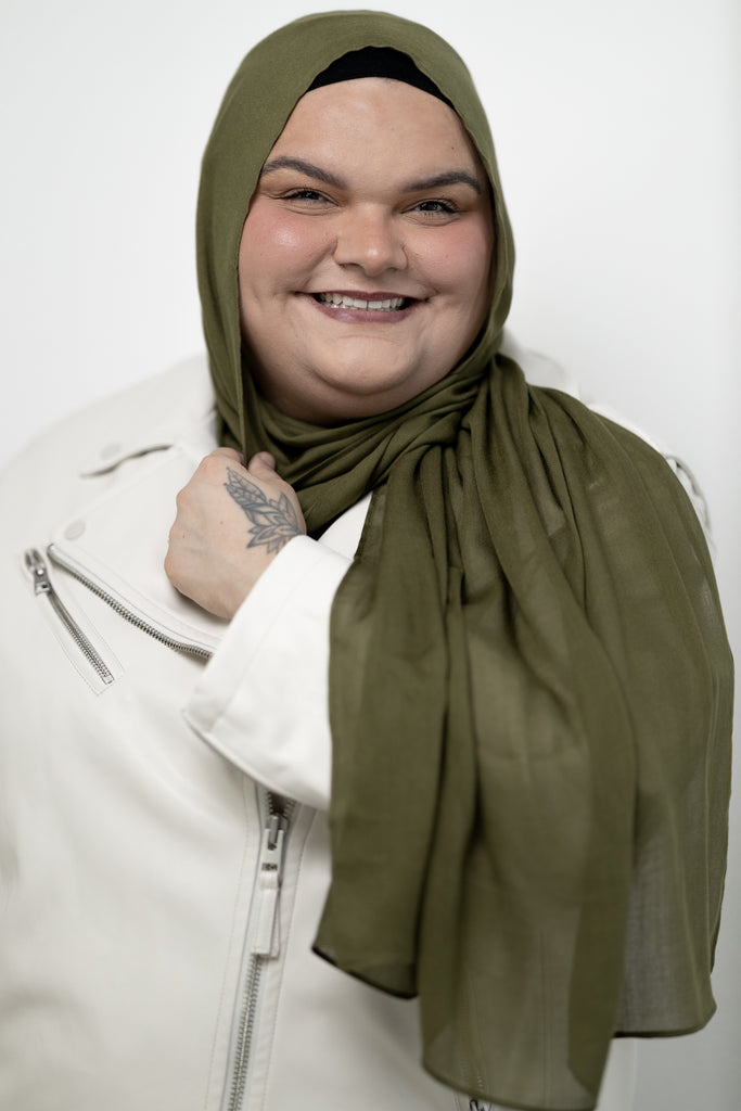 woman modeling a moss green modal hijab 