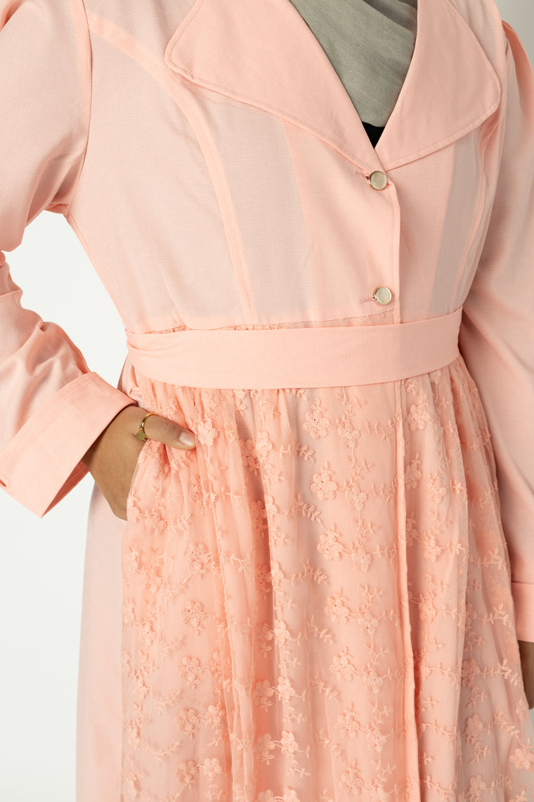 light pink long sleeved cardigan embellished with creme lace with pockets and a waist tie