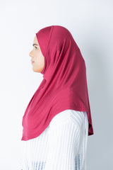 woman wearing a maroon jersey slip on one piece hijab