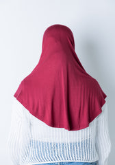 woman wearing a maroon jersey slip on one piece hijab