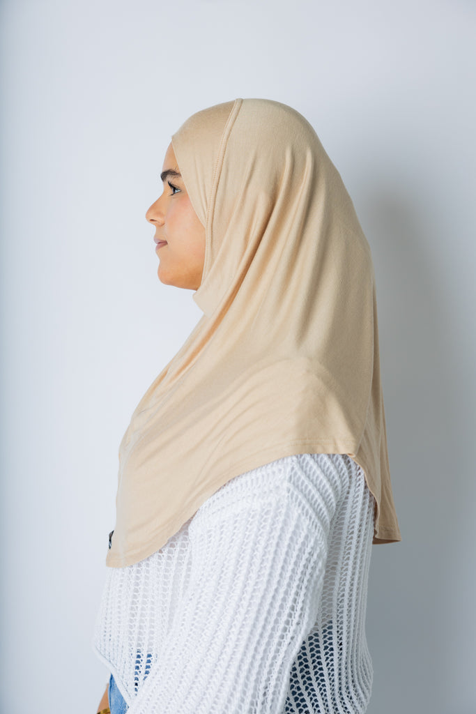 woman wearing a tan one piece slip on hijab