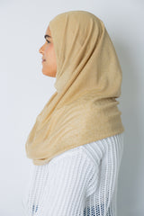 woman wearing a gold shimmer two piece amira slip on hijab