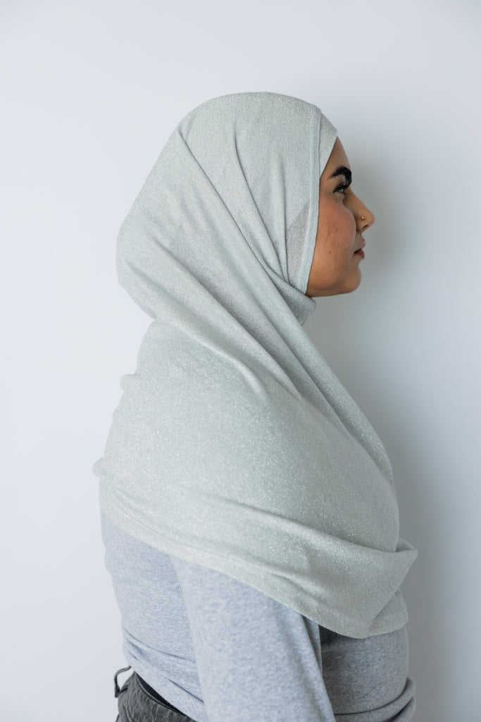 woman wearing a silver shimmer two piece amira slip on hijab