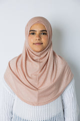 woman wearing light pink shimmer two piece amira slip on hijab