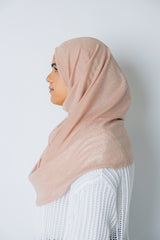 woman wearing light pink shimmer two piece amira slip on hijab