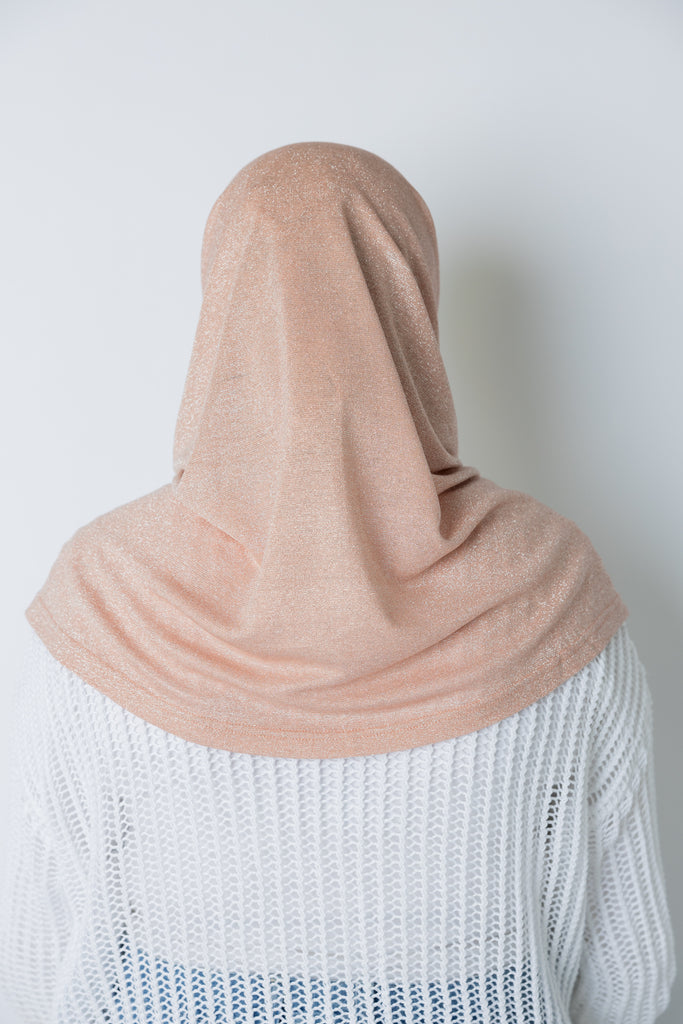 woman wearing light pink shimmer two piece amira slip on hijab