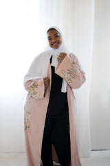 light pink textured long sleeved maxi floral embroidered abaya with waist tie and pockets