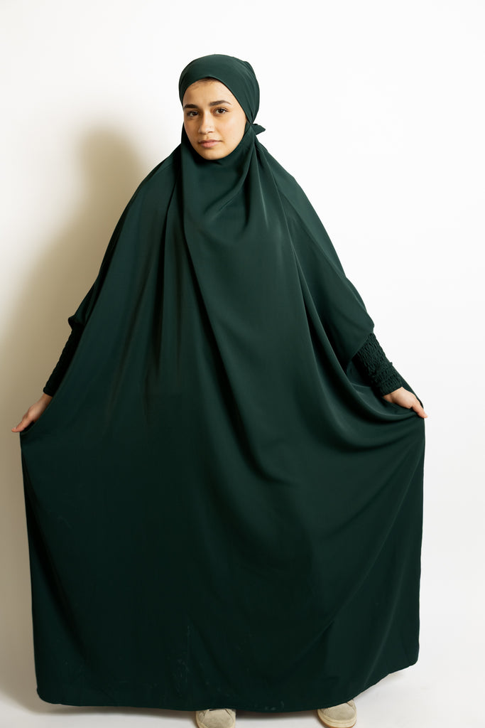 one-piece prayer outfit features a quick attached tie-back hijab