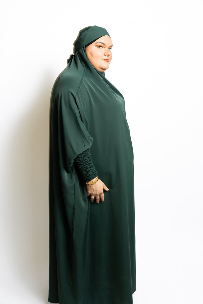 one-piece prayer outfit features a quick attached tie-back hijab