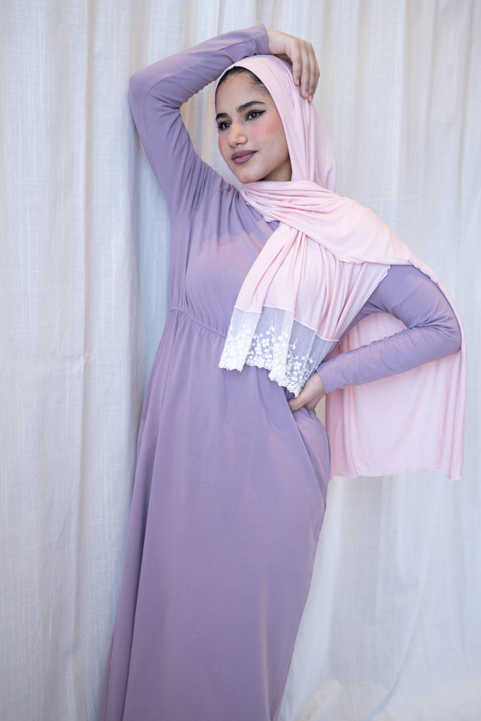 muslim woman wearing a lavender long sleeve maxi dress