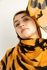 Tiger Stripes modal hijab, a striking blend of deep gold and bold black 