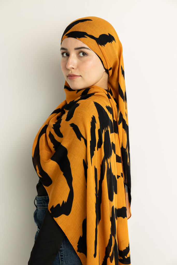 Tiger Stripes modal hijab, a striking blend of deep gold and bold black 