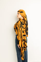 Tiger Stripes modal hijab, a striking blend of deep gold and bold black 