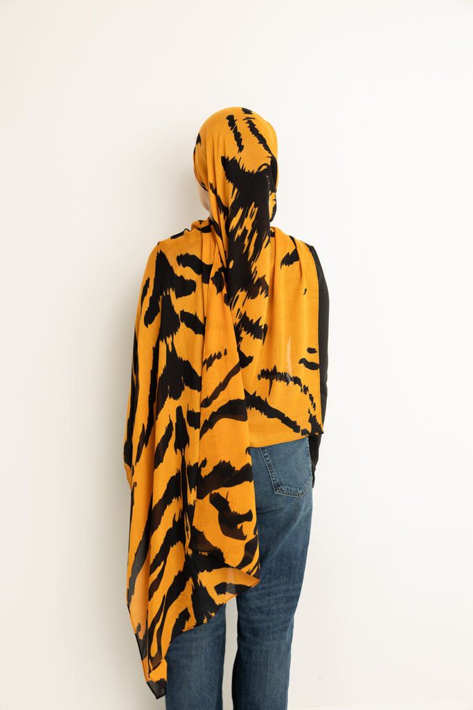 Tiger Stripes modal hijab, a striking blend of deep gold and bold black 