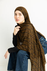 crocodile skin-inspired modal hijab print in warm brown hues.