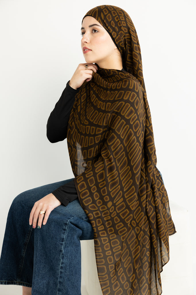 crocodile skin-inspired modal hijab print in warm brown hues.