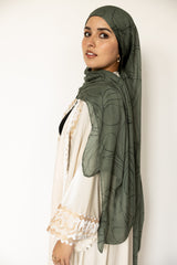 woman wearing olive green modal print hijab with olives and olive leaves branches Palestinian design 