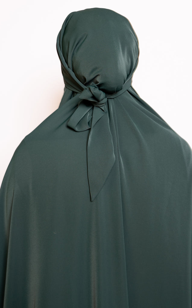 one-piece prayer outfit features a quick attached tie-back hijab