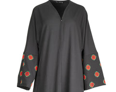 a black abaya with button clasps and pockets and watermelon and poppy tatreez palestinian embroidery along the sleeves 