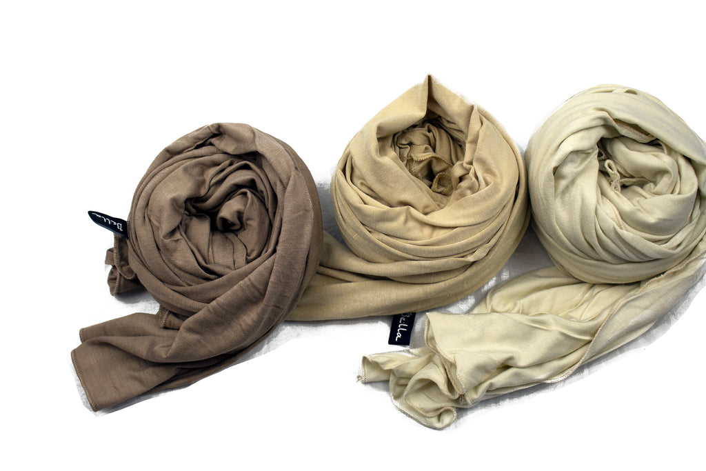three nude jersey hijabs bundled together in ivory, gold, and taupe