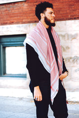 man wearing shmagh keffiyeh hatta wrapped around his shoulders