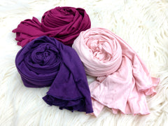 three jersey hijabs in light pink, magenta, and purple