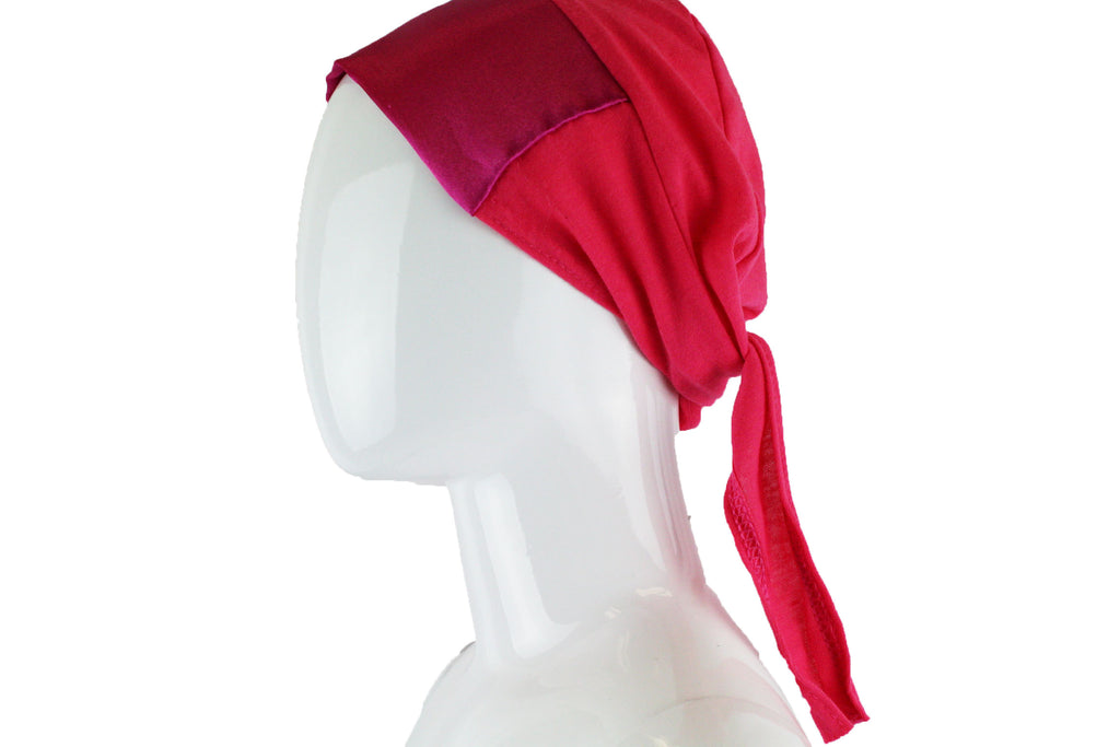 hot pink tie back under cap with a satin trim
